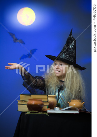 Girl dressed up as witch in night making magic Girl dressed up as witch in night making magic 4466706