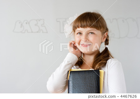 Cute preteen schoolgirl portrait near whiteboard Cute preteen schoolgirl portrait near whiteboard 4467626