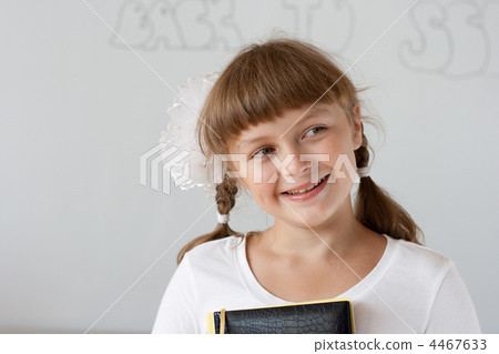 Cute preteen schoolgirl portrait near whiteboard Cute preteen schoolgirl portrait near whiteboard 4467633