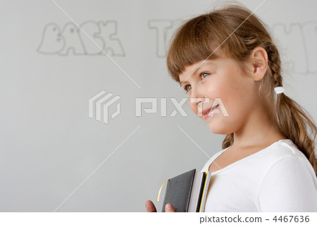 Cute preteen schoolgirl portrait near whiteboard Cute preteen schoolgirl portrait near whiteboard 4467636