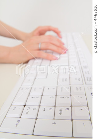 Women's hand hitting the keyboard 4468616
