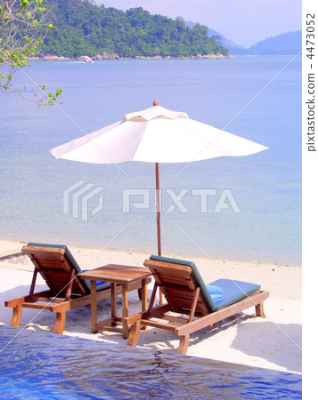 Beach resort umbrellas and summer beds Beach resort umbrellas and summer beds 4473052
