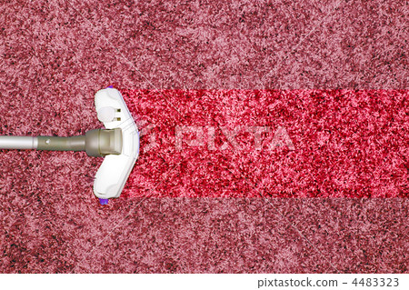The metal pipe of vacuum cleaner in action - clean stripe on the carpet. The metal pipe of vacuum cleaner in action - clean stripe on the carpet. 4483323