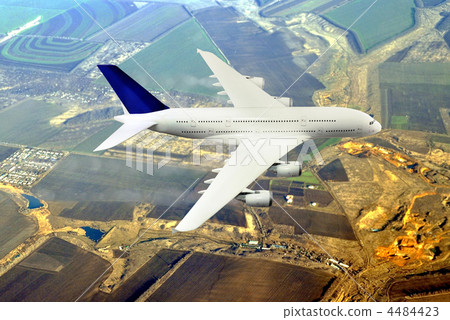 Modern airplane  in the sky near Airport. 4484423