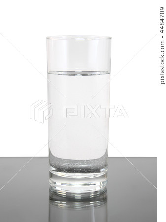 Glass of clean water on white- gray background. Glass of clean water on white- gray background. 4484709