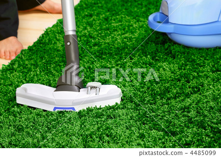 The metal pipe of vacuum cleaner in action -clean a carpet and floor The metal pipe of vacuum cleaner in action -clean a carpet and floor 4485099