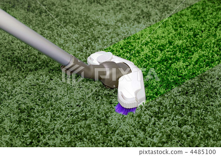 The metal pipe of vacuum cleaner in action - clean stripe on the carpet. The metal pipe of vacuum cleaner in action - clean stripe on the carpet. 4485100