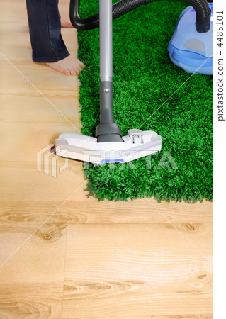 Vacuum cleaner in action - men cleaner a carpet. Vacuum cleaner in action - men cleaner a carpet. 4485101