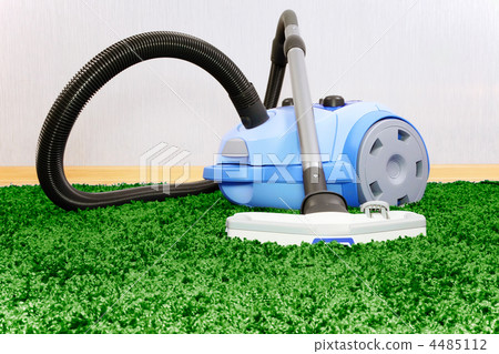 Vacuum cleaner on green carpet Vacuum cleaner on green carpet 4485112