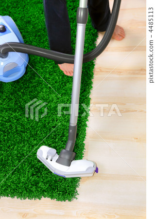 The metal pipe of vacuum cleaner in action -clean a carpet and floor The metal pipe of vacuum cleaner in action -clean a carpet and floor 4485113