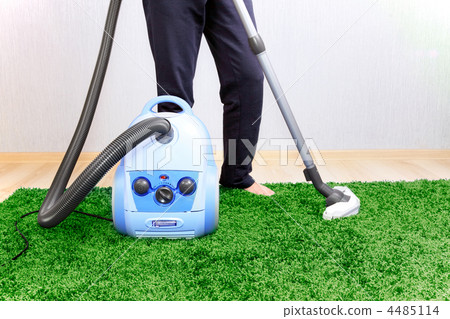 Vacuum cleaner in action - men cleaner a carpet. Vacuum cleaner in action - men cleaner a carpet. 4485114