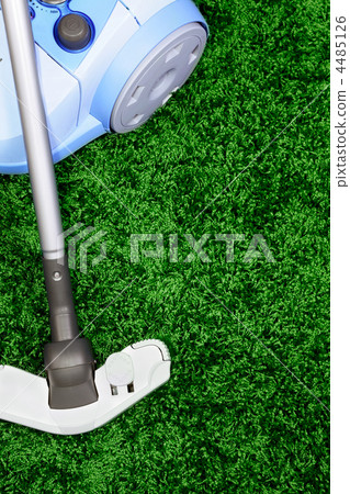 The metal pipe of vacuum cleaner in action -clean a carpet and floor The metal pipe of vacuum cleaner in action -clean a carpet and floor 4485126