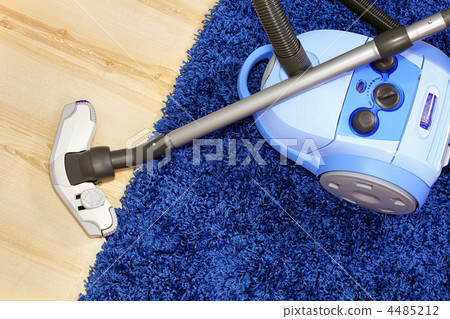 Vacuum cleaner stand on blue carpet. Vacuum cleaner stand on blue carpet. 4485212