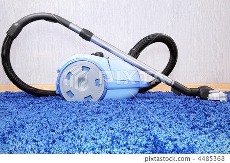 Vacuum cleaner stand on blue carpet. Vacuum cleaner stand on blue carpet. 4485368