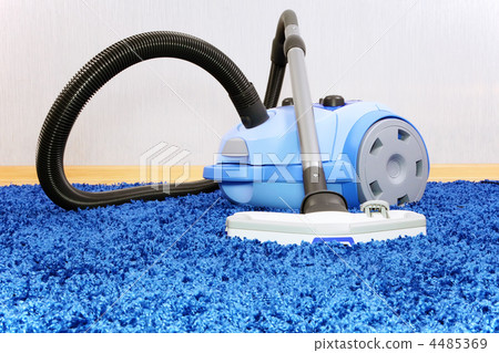 Vacuum cleaner stand on blue carpet. Vacuum cleaner stand on blue carpet. 4485369