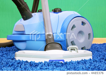 Vacuum cleaner stand on blue carpet. Vacuum cleaner stand on blue carpet. 4485376