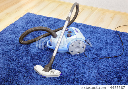 Vacuum cleaner stand on blue carpet. Vacuum cleaner stand on blue carpet. 4485387
