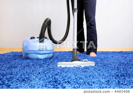 Vacuum cleaner in action-men cleaner a carpet. Vacuum cleaner in action-men cleaner a carpet. 4485406