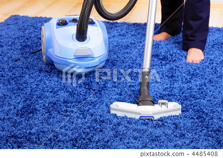 Vacuum cleaner in action-men cleaner a carpet. Vacuum cleaner in action-men cleaner a carpet. 4485408