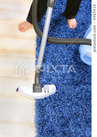 Vacuum cleaner in action-men cleaner a carpet. Vacuum cleaner in action-men cleaner a carpet. 4485419