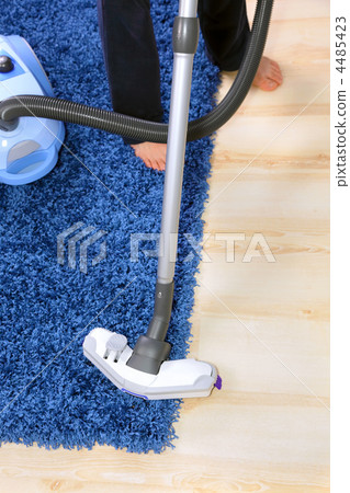 Vacuum cleaner in action-men cleaner a carpet. Vacuum cleaner in action-men cleaner a carpet. 4485423