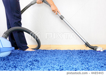 Vacuum cleaner in action-men cleaner a carpet. Vacuum cleaner in action-men cleaner a carpet. 4485443