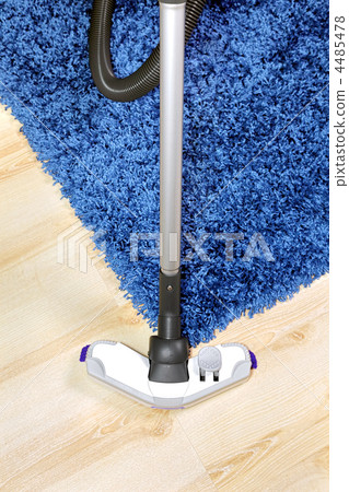 Metal pipe of vacuum cleaner in action. 4485478