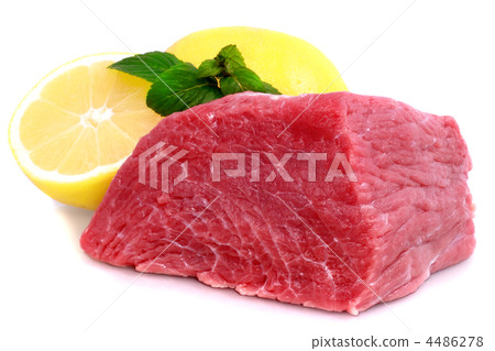 Cut of  beef steak with lemon slice. 4486278