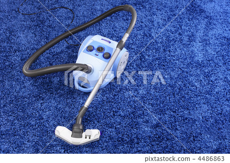 Vacuum cleaner stand on blue carpet. Vacuum cleaner stand on blue carpet. 4486863