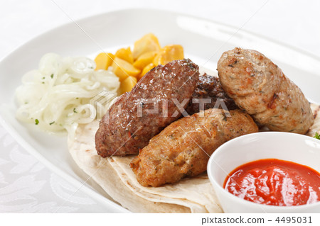 tasty cutlets with sauce and tortilla 4495031
