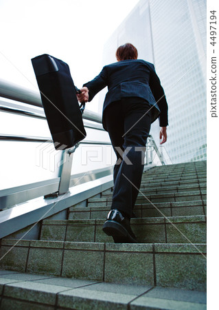A businessman going up the stairs 4497194