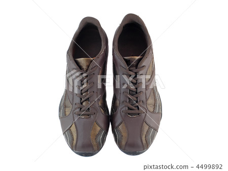 Pair of leather brown sneakers. Isolated 4499892