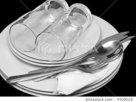Pile of white plates, glasses, forks, spoons. Pile of white plates, glasses, forks, spoons. 4500028