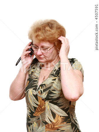 Senior lady speaks by a mobile phone. 4507591