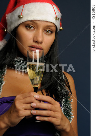 beautiful woman drinking champagne into Christmas 4516905