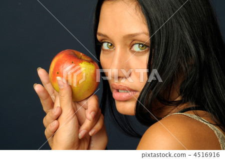 Beautiful exotic woman with apple 4516916