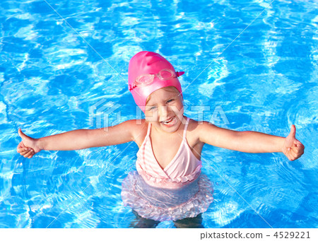 Thumb up of kid in swimming pool. 4529221