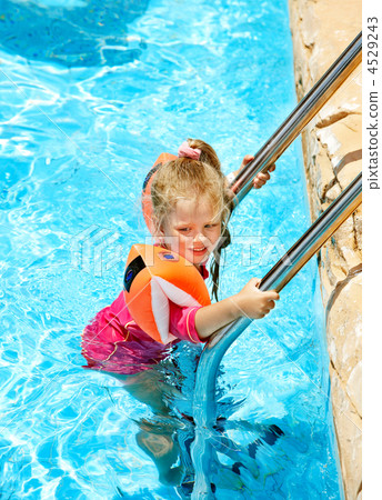 Child with armbands in swimming pool 4529243