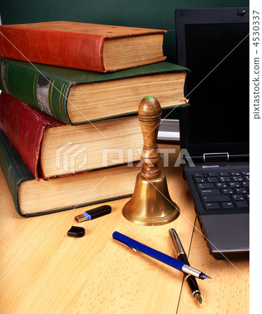 Books and laptop. School supplies. Books and laptop. School supplies. 4530337