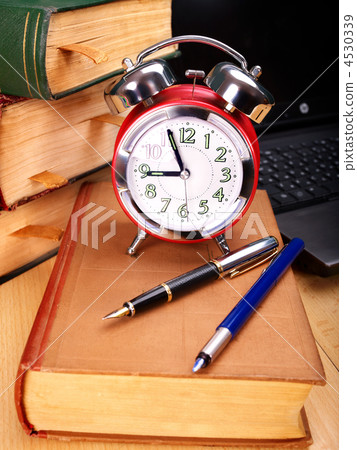 Books and laptop. School supplies. 4530339