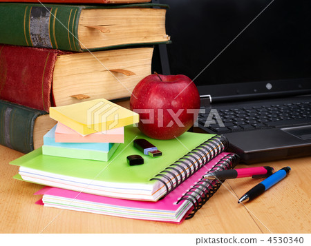 Books and laptop. School supplies. 4530340