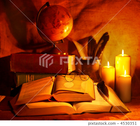 Stack old book and candle. Stack old book and candle. 4530351