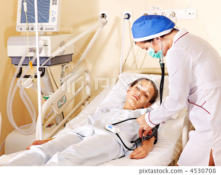 Doctor treats patient with stethoscope. 4530708
