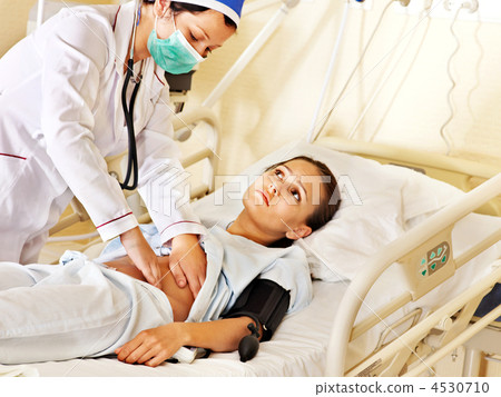 Doctor treats patient with stethoscope. 4530710