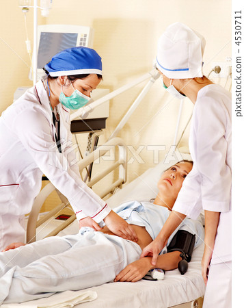 Doctor treats patient with stethoscope. 4530711