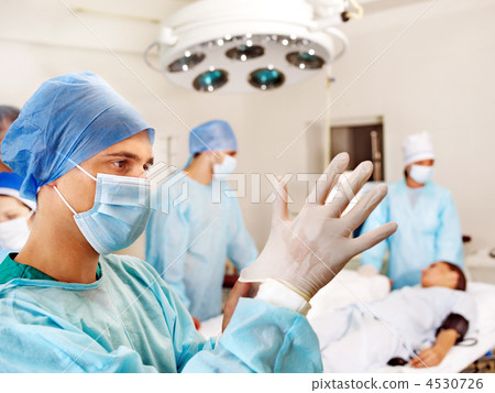 Patient on gurney in operating room. Patient on gurney in operating room. 4530726