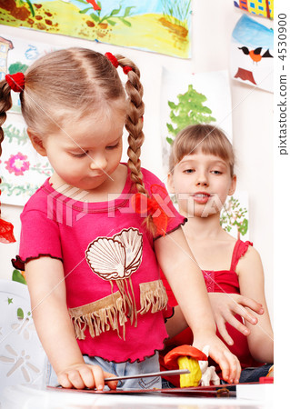 Group people in playroom. 4530900