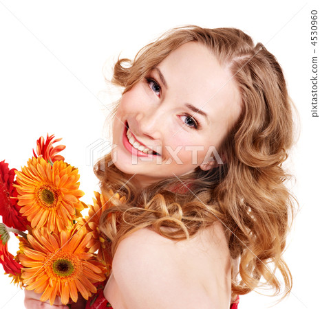 Happy young woman holding flowers. 4530960