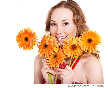 Happy young woman holding flowers. 4530963