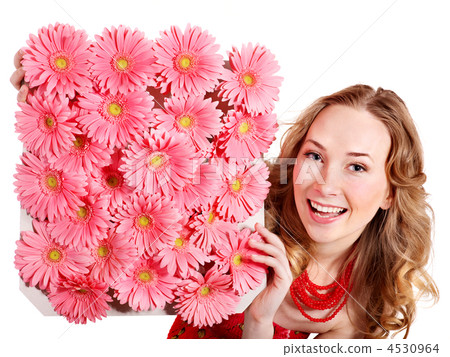 Young woman holding flowers. 4530964
